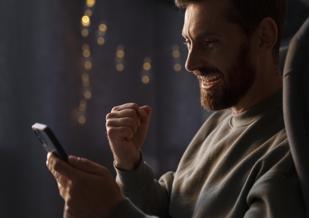 A boy using a smartphone with eSIM technology, demonstrating seamless connectivity and remote provisioning for IoT devices.